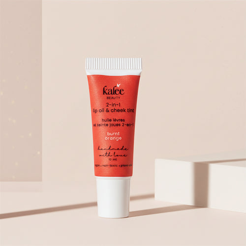 Kalee Beauty Burnt Orange 2-in-1 Lip Oil & Cheek Tint ,handmade in a minimalist squeeze tube; vegan and gentle formula.